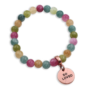 Multicolored beaded bracelet with a 'SO LOVED' charm on a white background