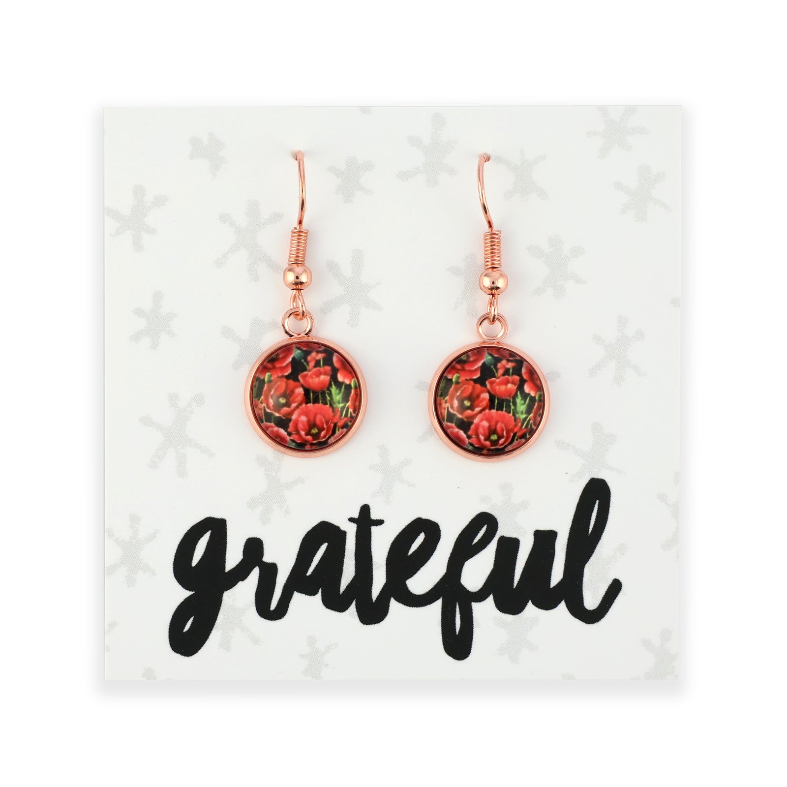 Rose gold floral earrings on a card with 'grateful' text