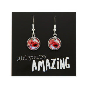 Earrings with floral design on a card with 'girl you're amazing' text