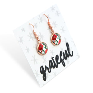 Rose gold floral earrings on a 'grateful' card with a white background
