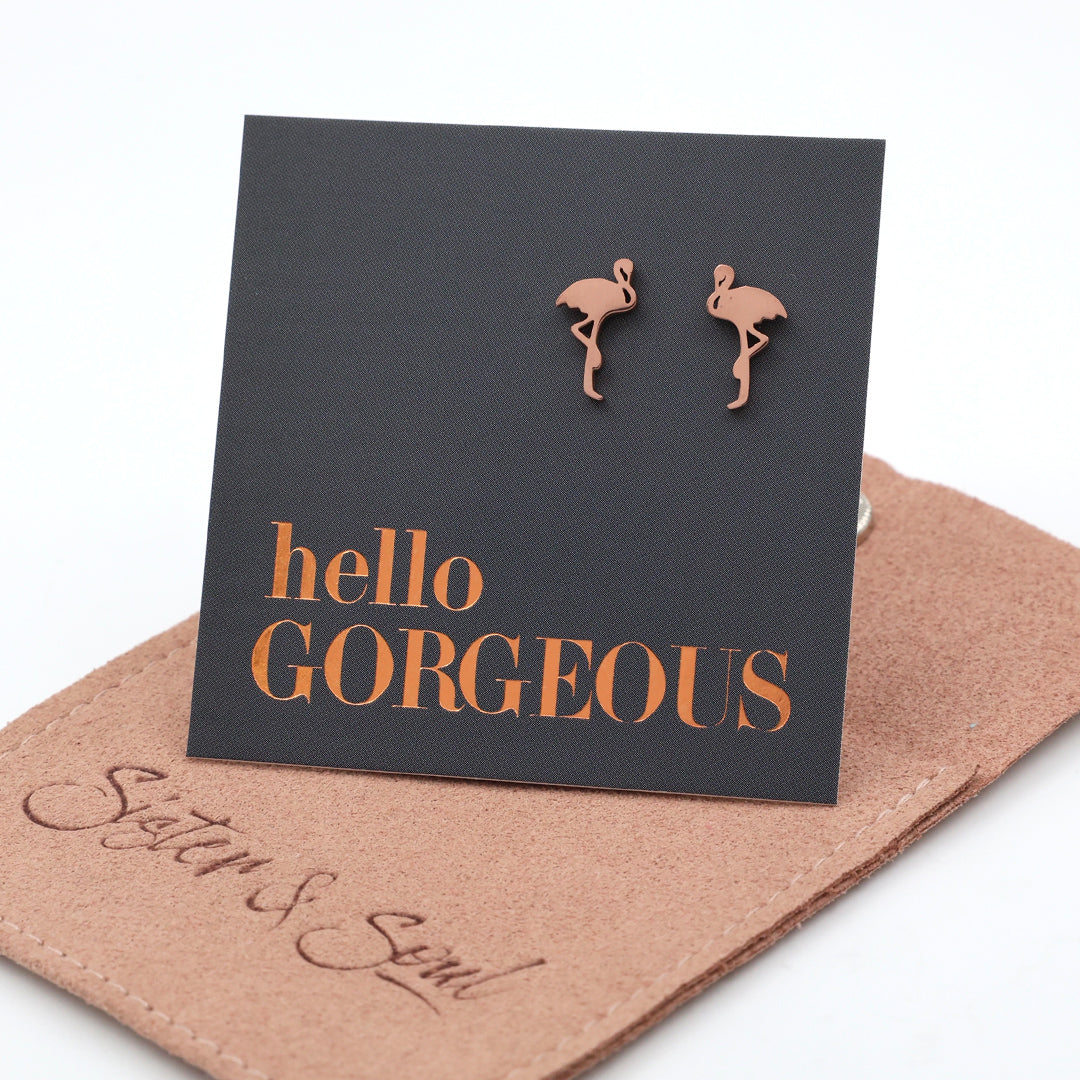 Flamingo shaped stainless steel earring studs on 'hello gorgeous' card on a cocoa pouch