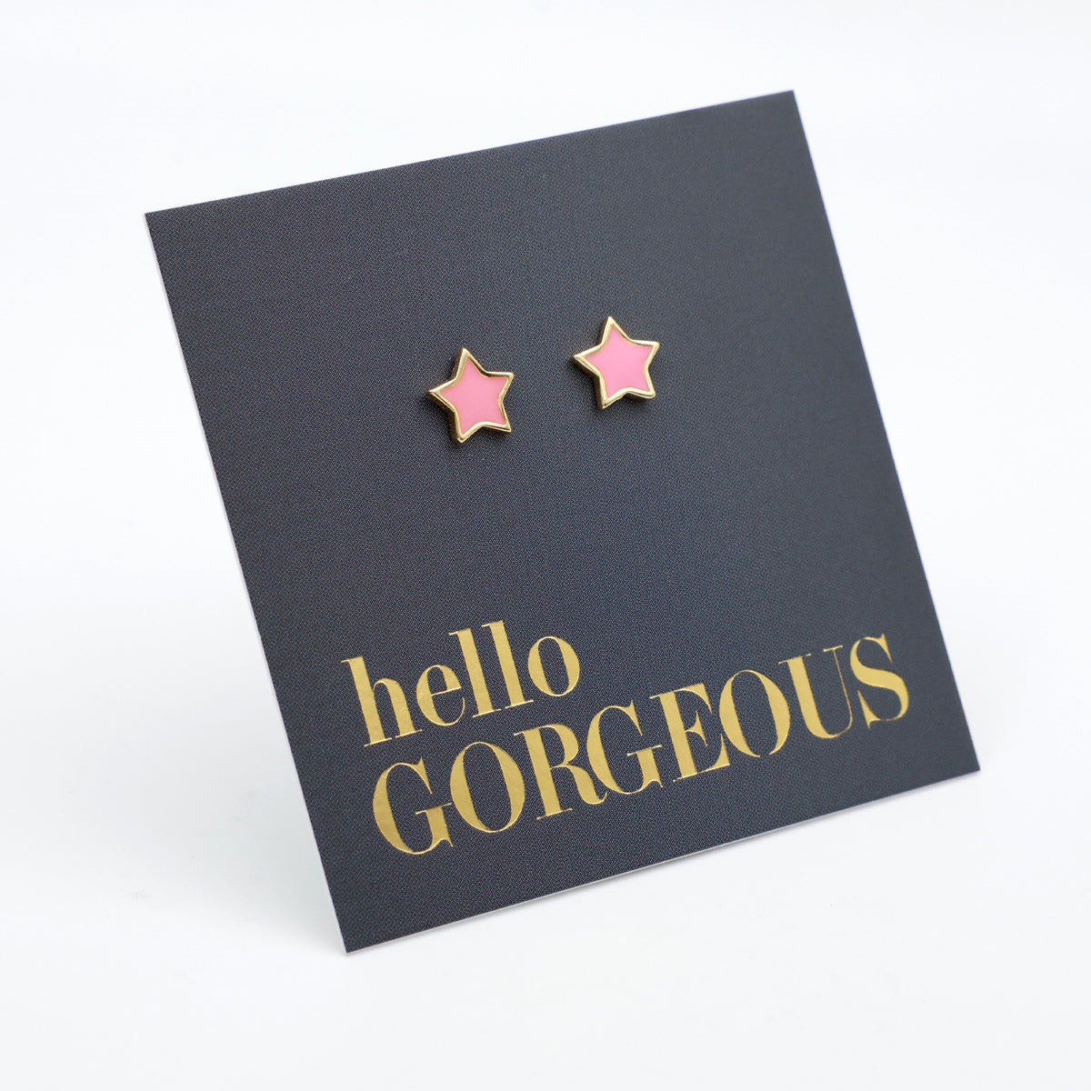 Pink star shaped studs presented on a grey card with gold 'Hello Gorgeous' writing.
