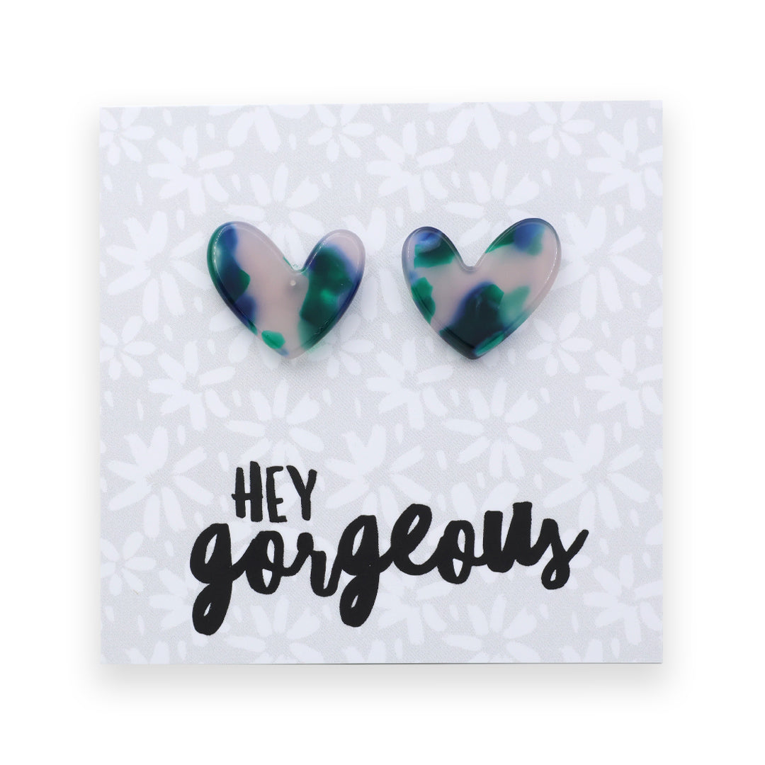 Heart-shaped earrings on a card with 'hey gorgeous' text