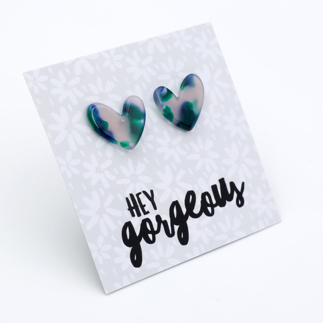 Heart-shaped earrings on a card with 'hey gorgeous' text