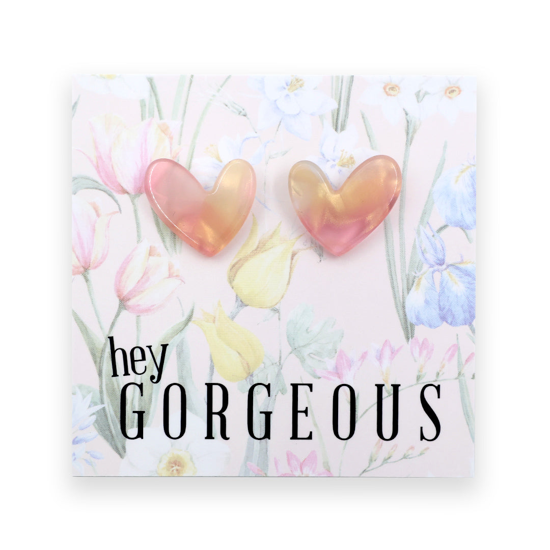 Heart-shaped earrings on a card with 'hey gorgeous' text