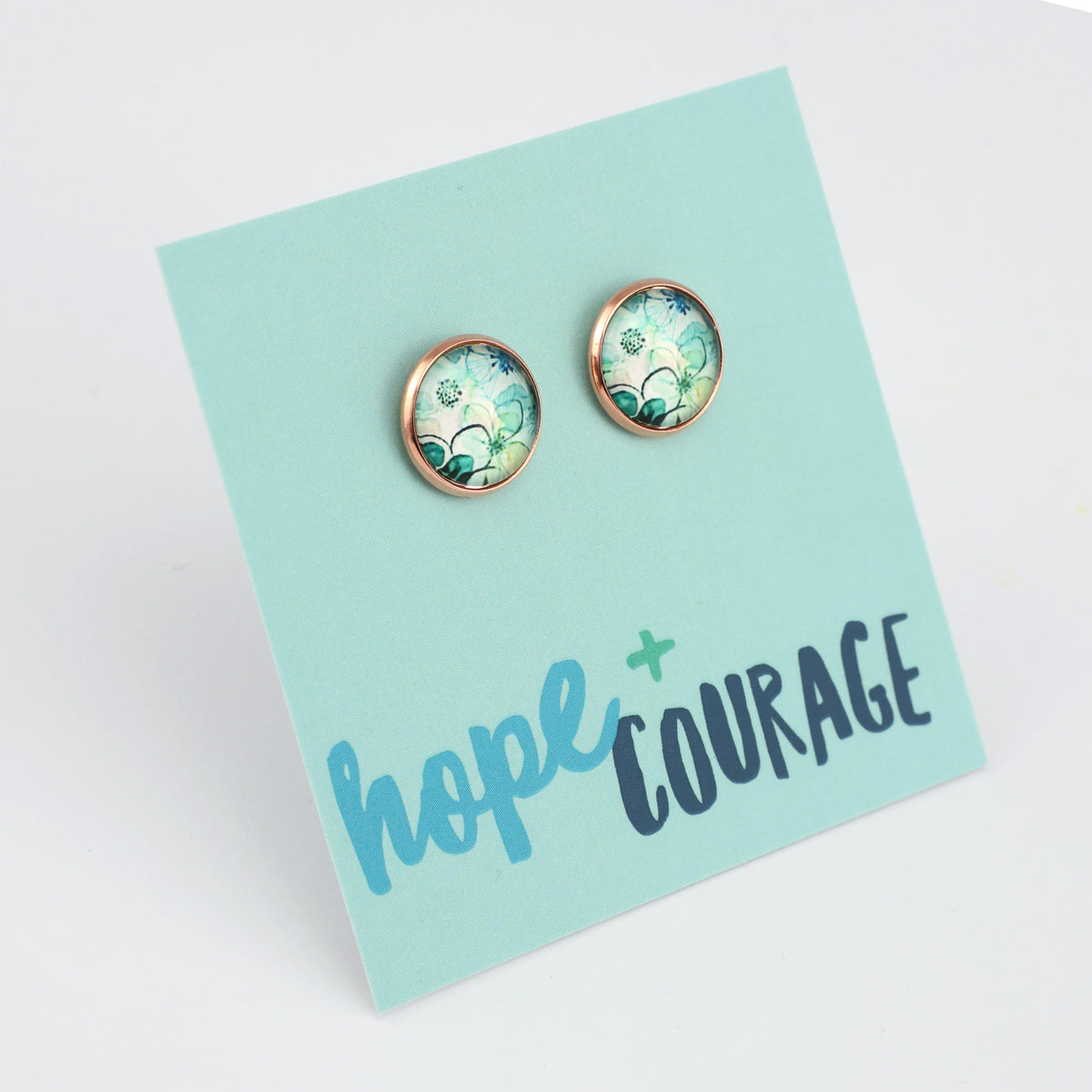 Pair of earrings on a 'hope + courage' card