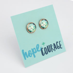 Pair of earrings on a 'hope + courage' card