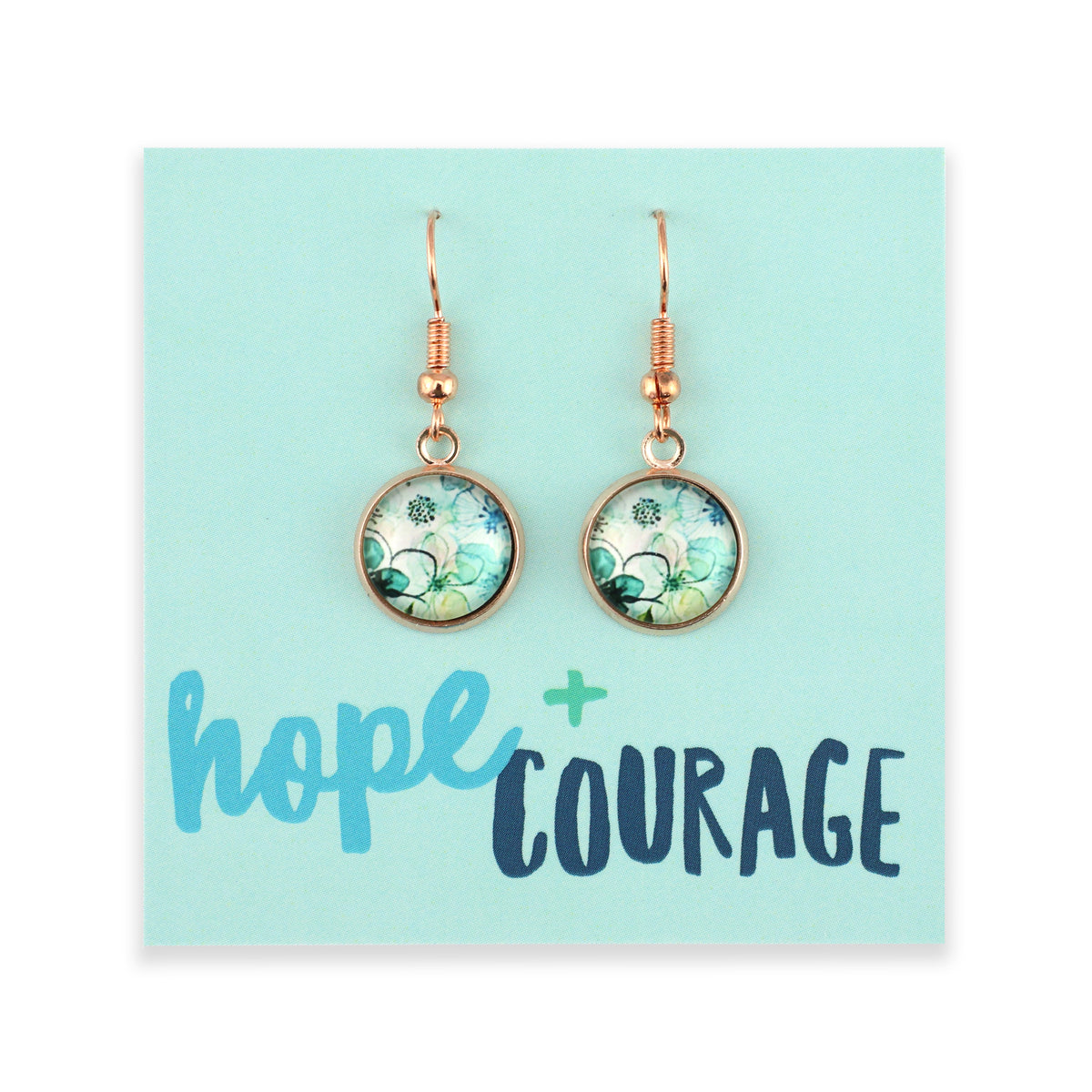 Pair of earrings on a card with 'hope + courage' text