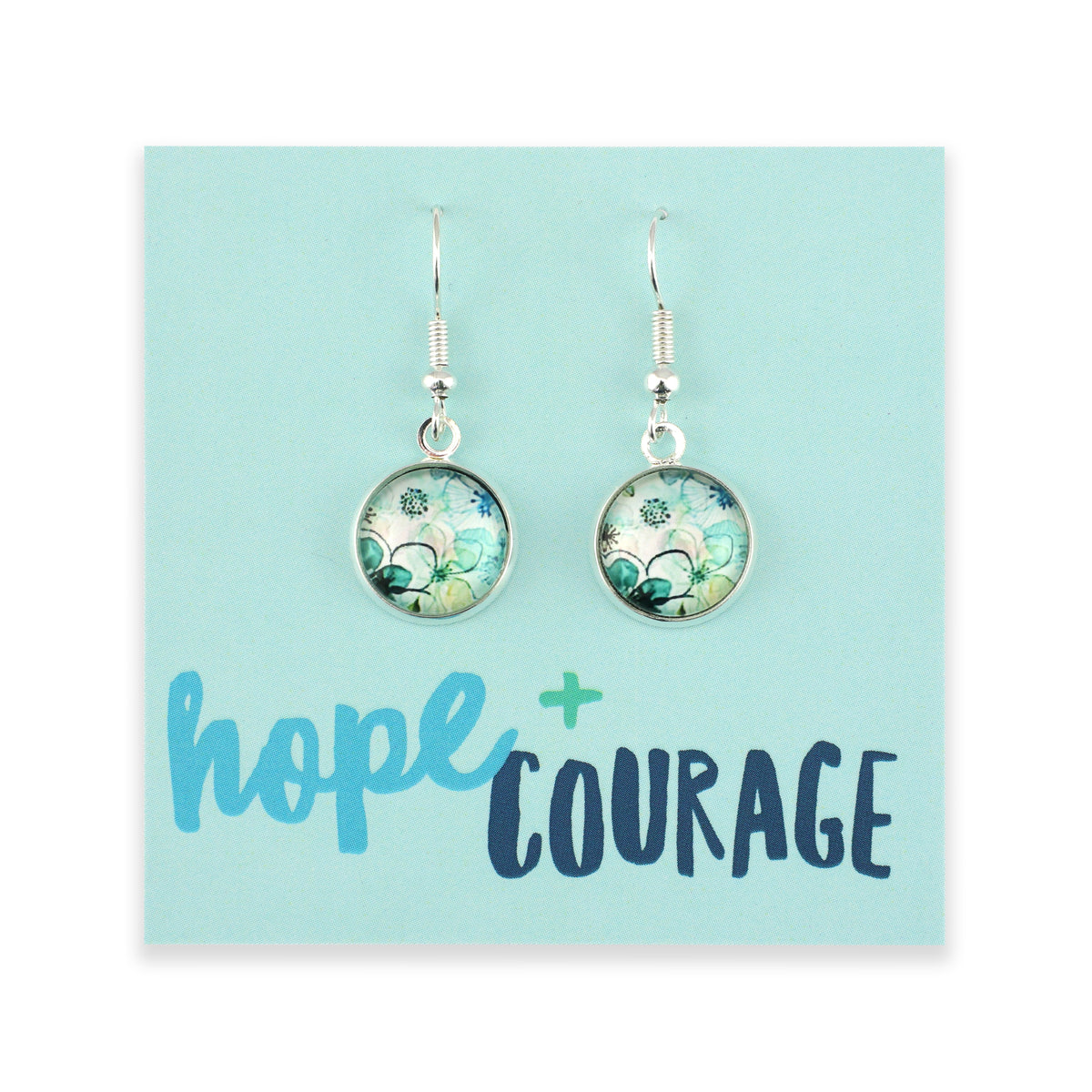Earrings on a card with 'hope + courage' text