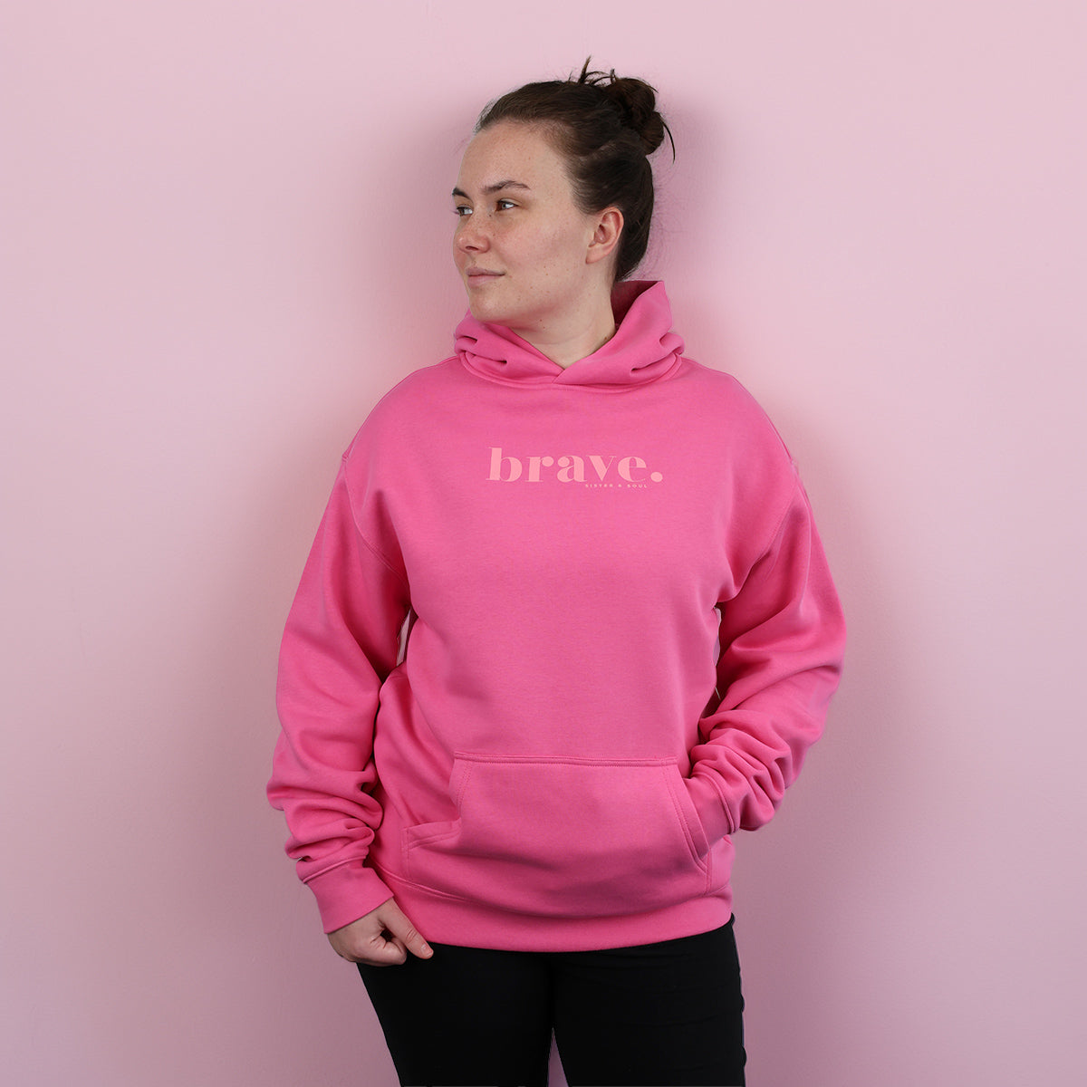 Hot Pink hoodie with 'brave.' pink text on a pink background