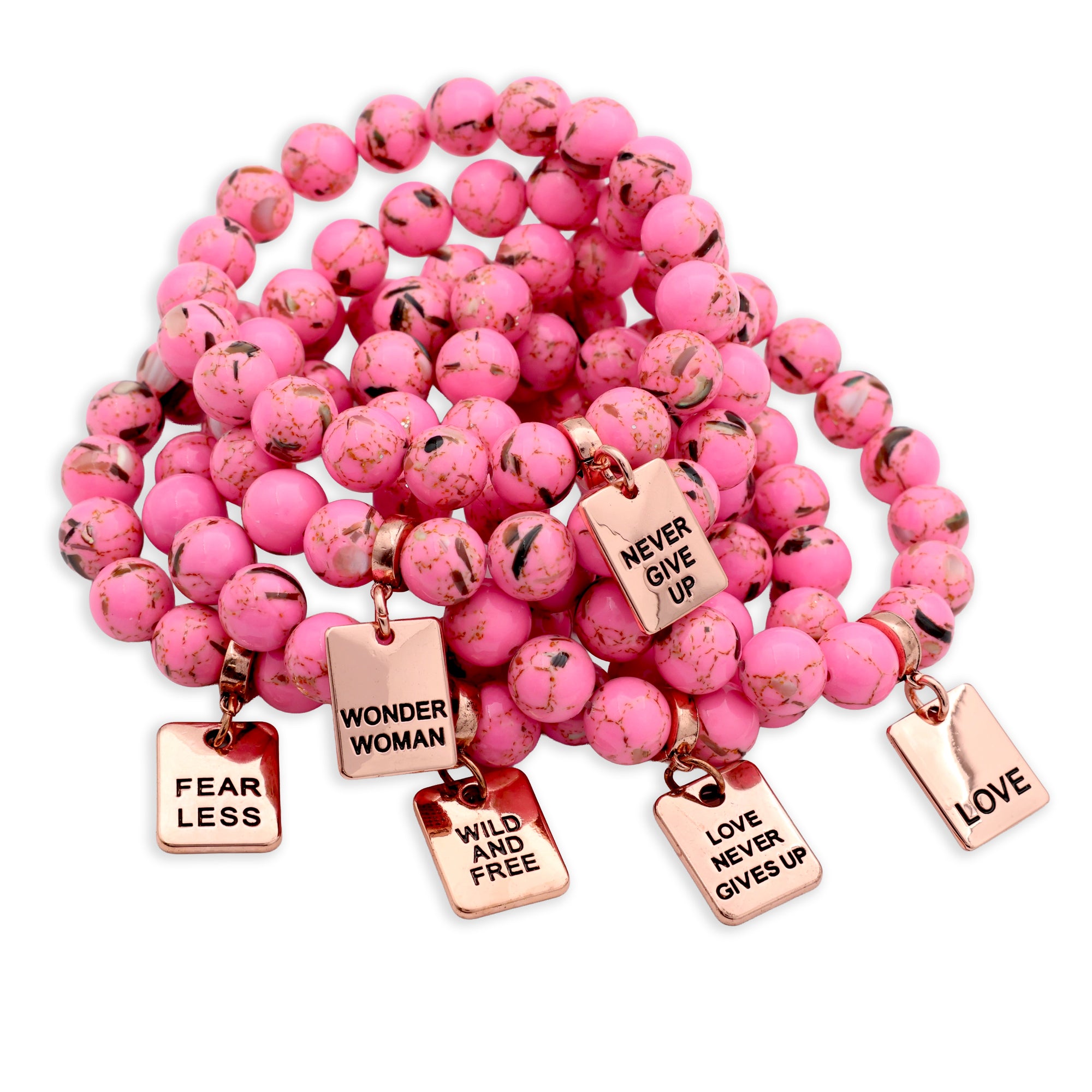 Pink beaded bracelet with motivational charms on a white background