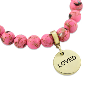 pink bracelet with loved charm
