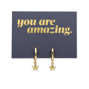 Gold star earrings on a card with 'you are amazing' text