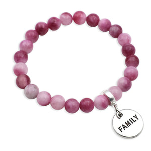 Pink beaded bracelet with a 'FAMILY' charm on a white background