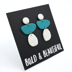 Pair of earrings on a card with 'Bold & Beautiful' text