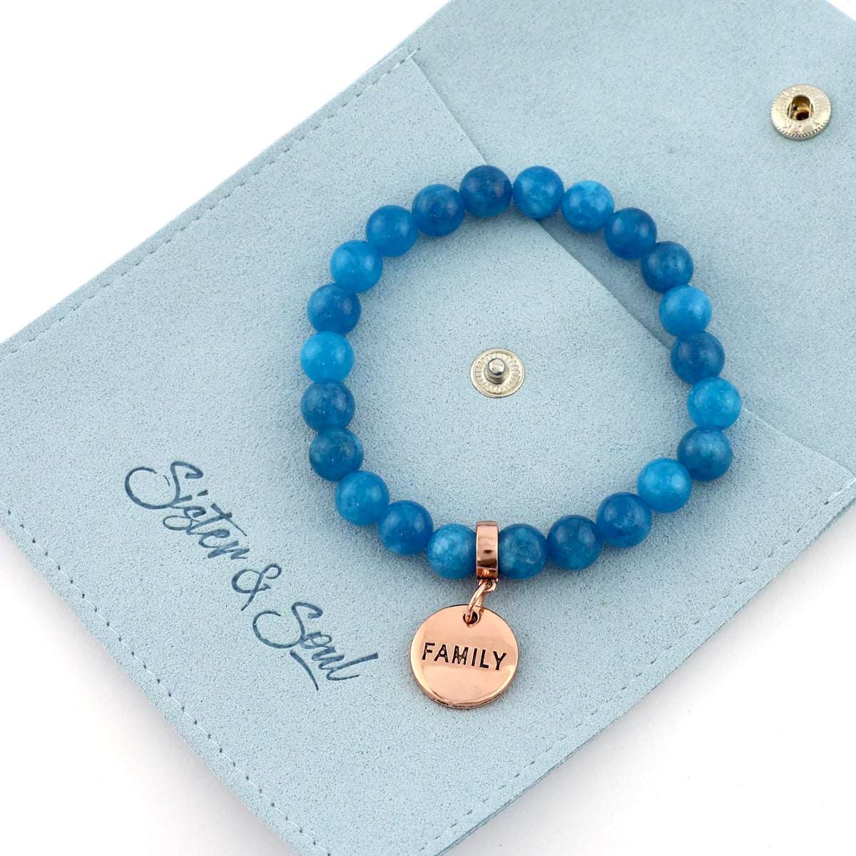 Blue beaded bracelet with a 'FAMILY' tag on a light blue card with 'Sister & Soul' branding.