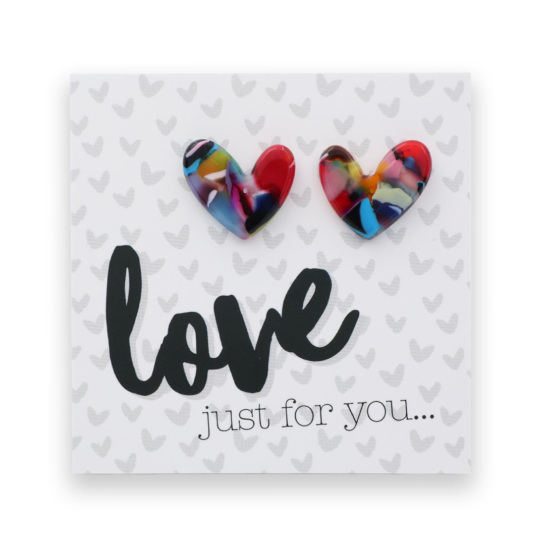 Heart-shaped earrings on a card with 'love just for you...' text