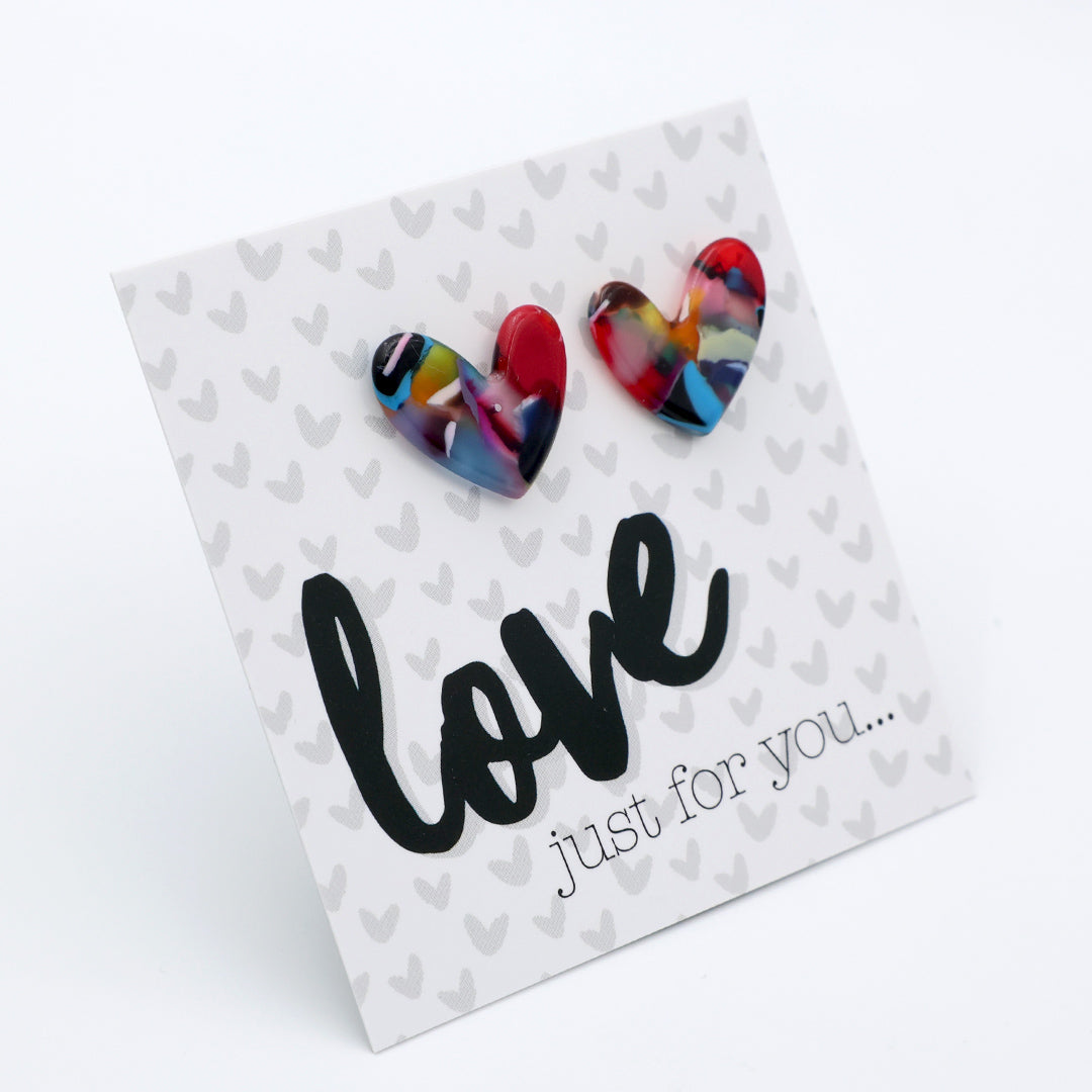 Heart-shaped earrings on a card with 'love just for you...' text