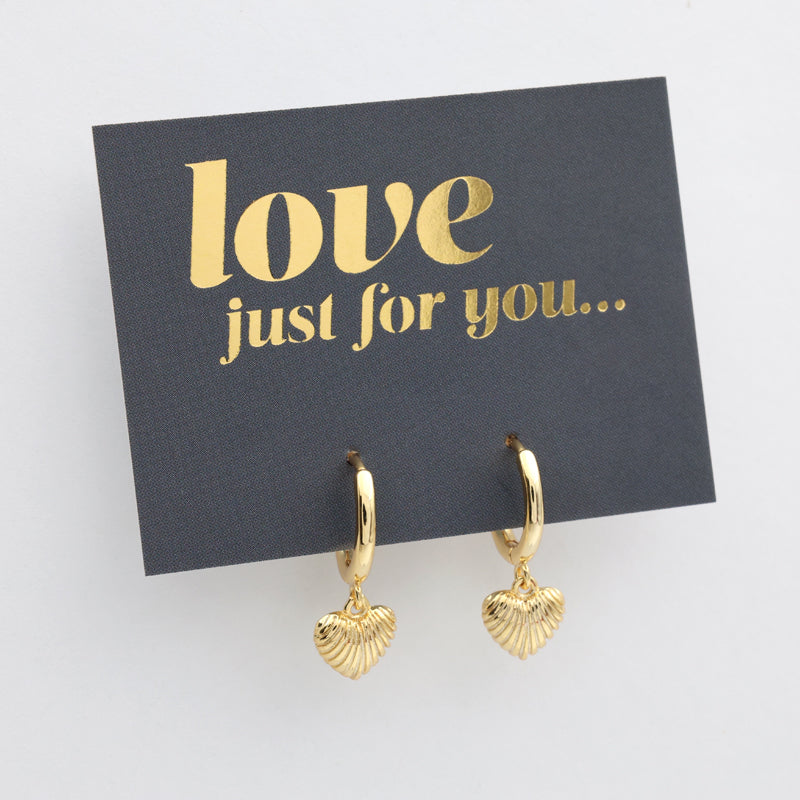 Gold heart-shaped earrings on a card with 'love just for you' text.