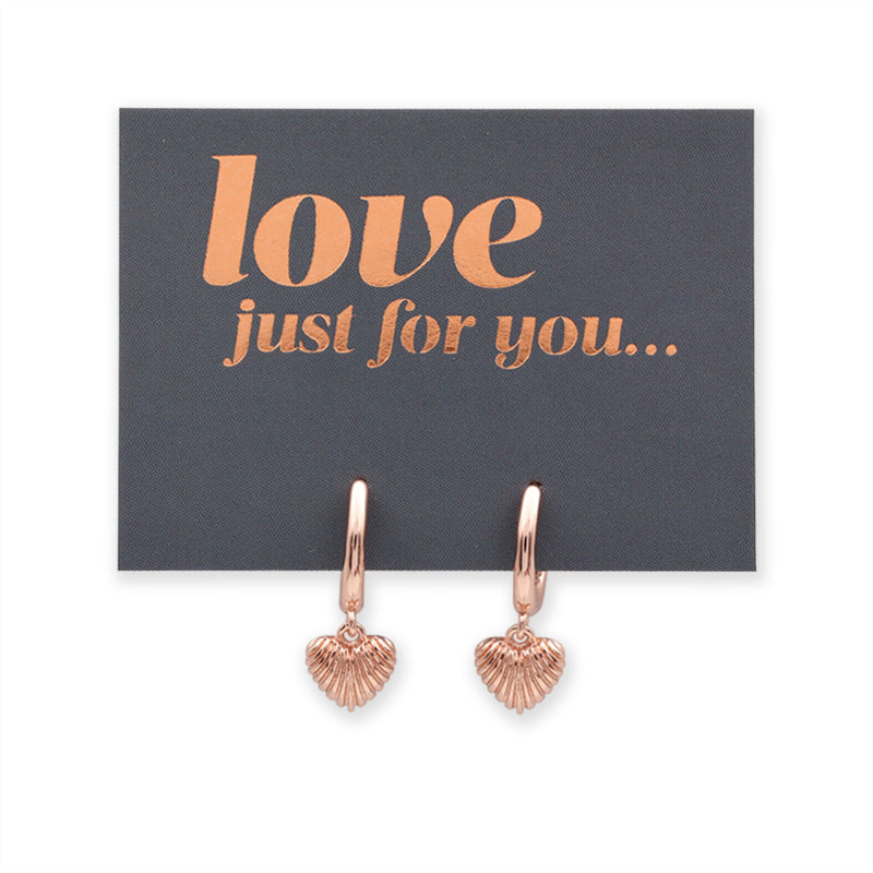 Rose gold heart-shaped earrings on a card with 'love just for you' text.