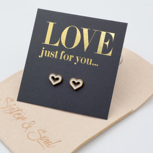Heart-shaped earrings on a 'LOVE just for you' card with beige envelope