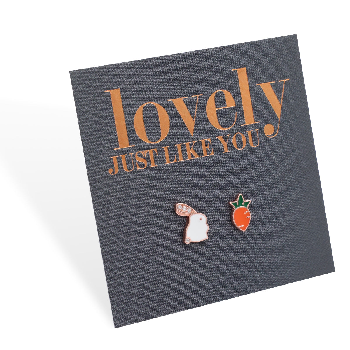 A pair of Easter style sterling silver stud earrings with one designed as a bunny and the other as a carrot, presented on a card with 'lovely just like you' printed in rose gold lettering.