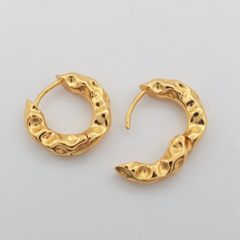 Gold hoop earrings on a love just for you card open