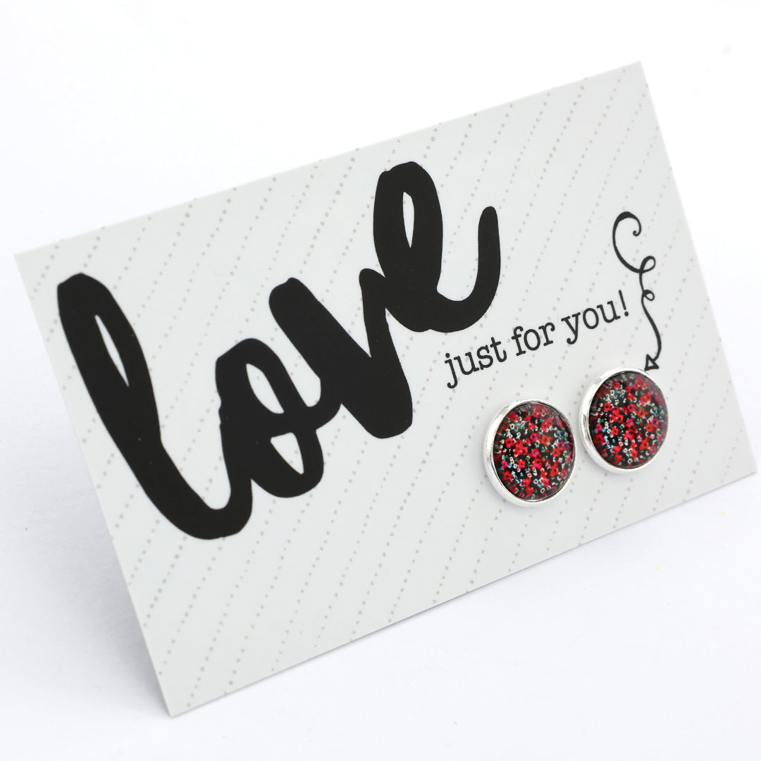 Red and black speckled earrings on a 'Love just for you!' card