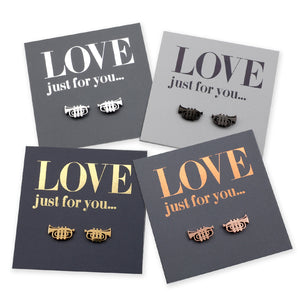 Four pairs of trumpet earrings on gray cards with 'LOVE just for you...' text.