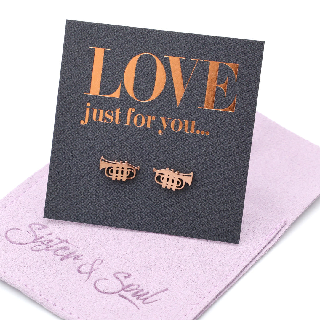 Rose gold trumpet earrings on a 'LOVE just for you' card with a purple cloth background