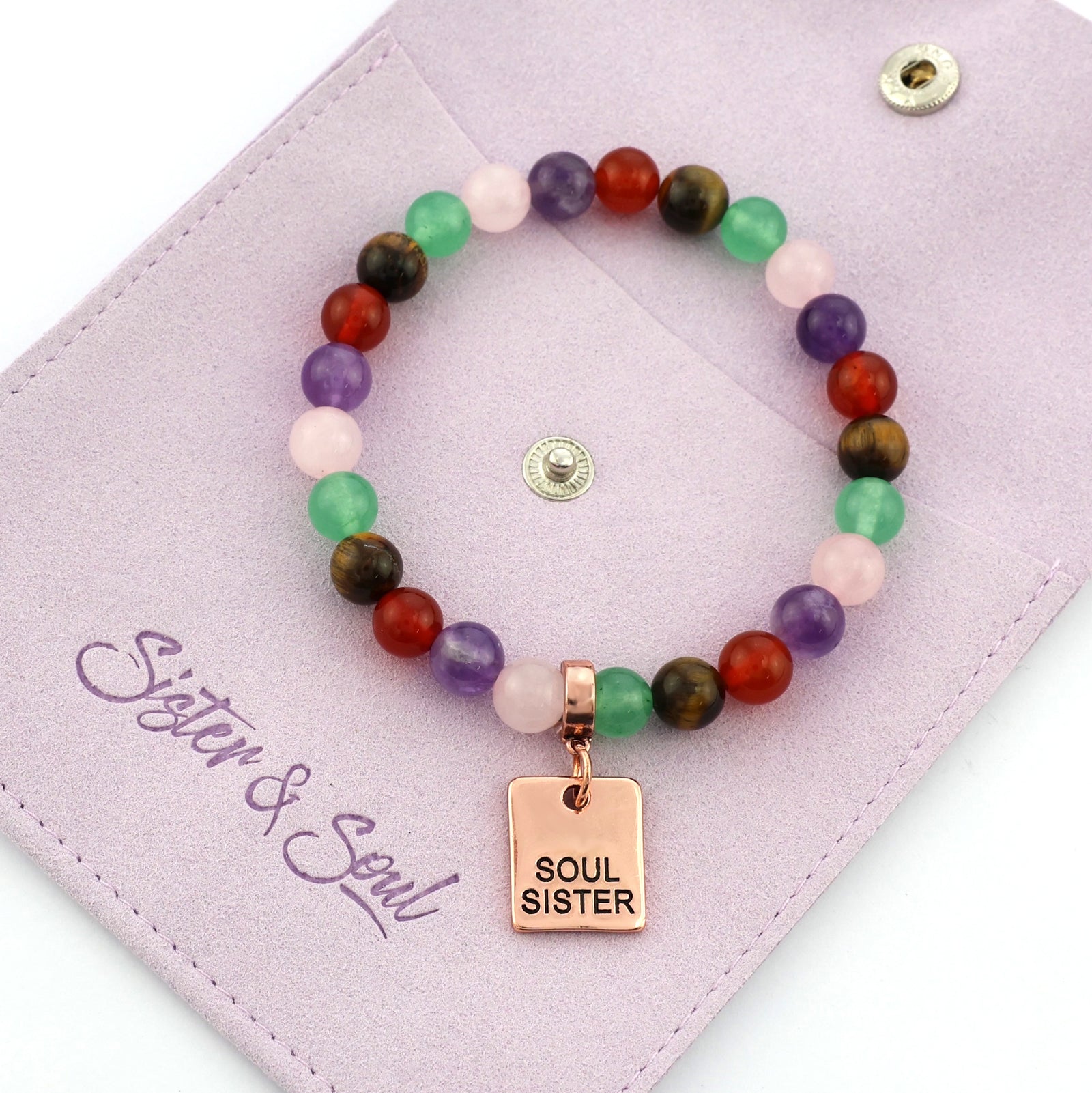 Colorful beaded bracelet with motivational charms on a white background