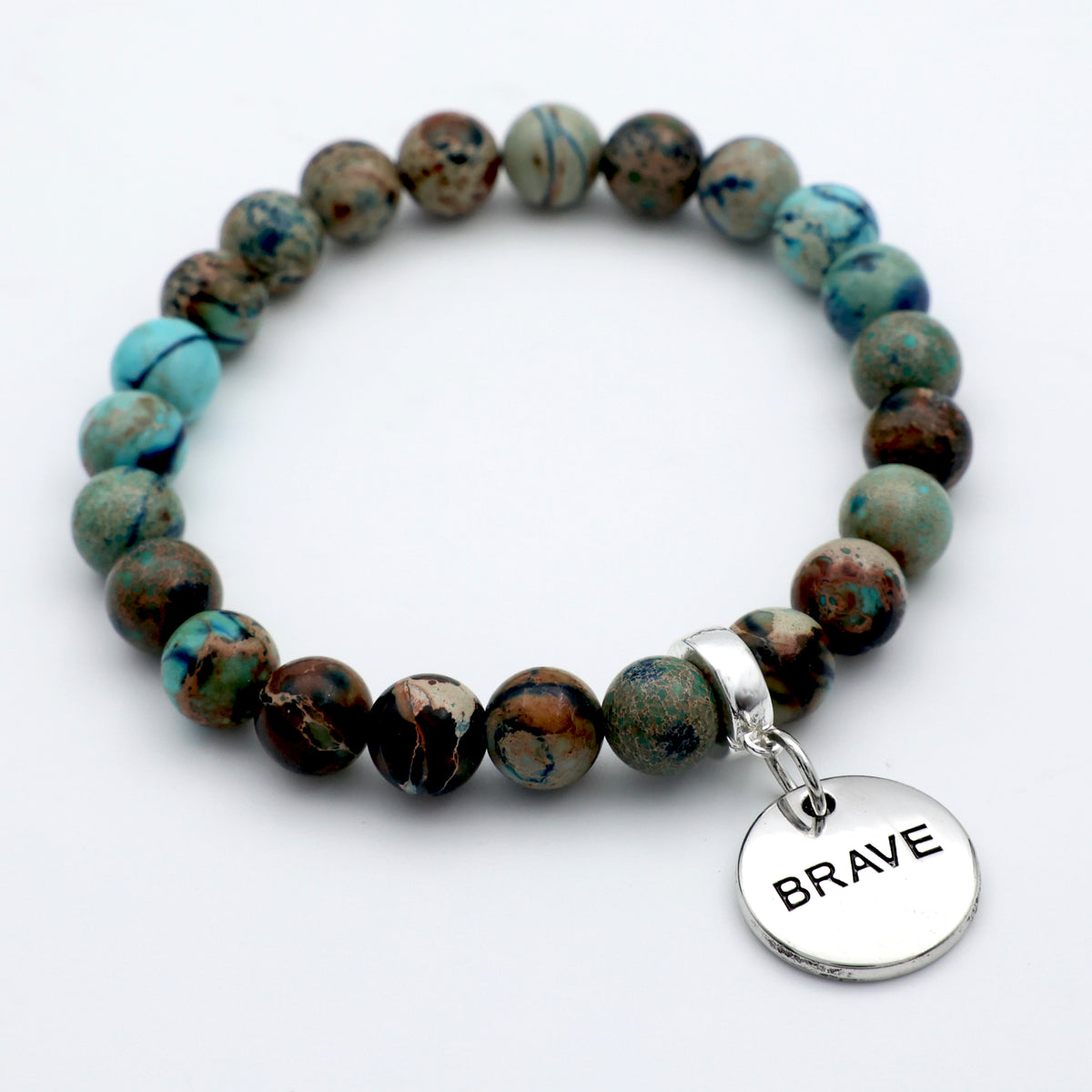 Beaded bracelet with a 'BRAVE' charm on a white background