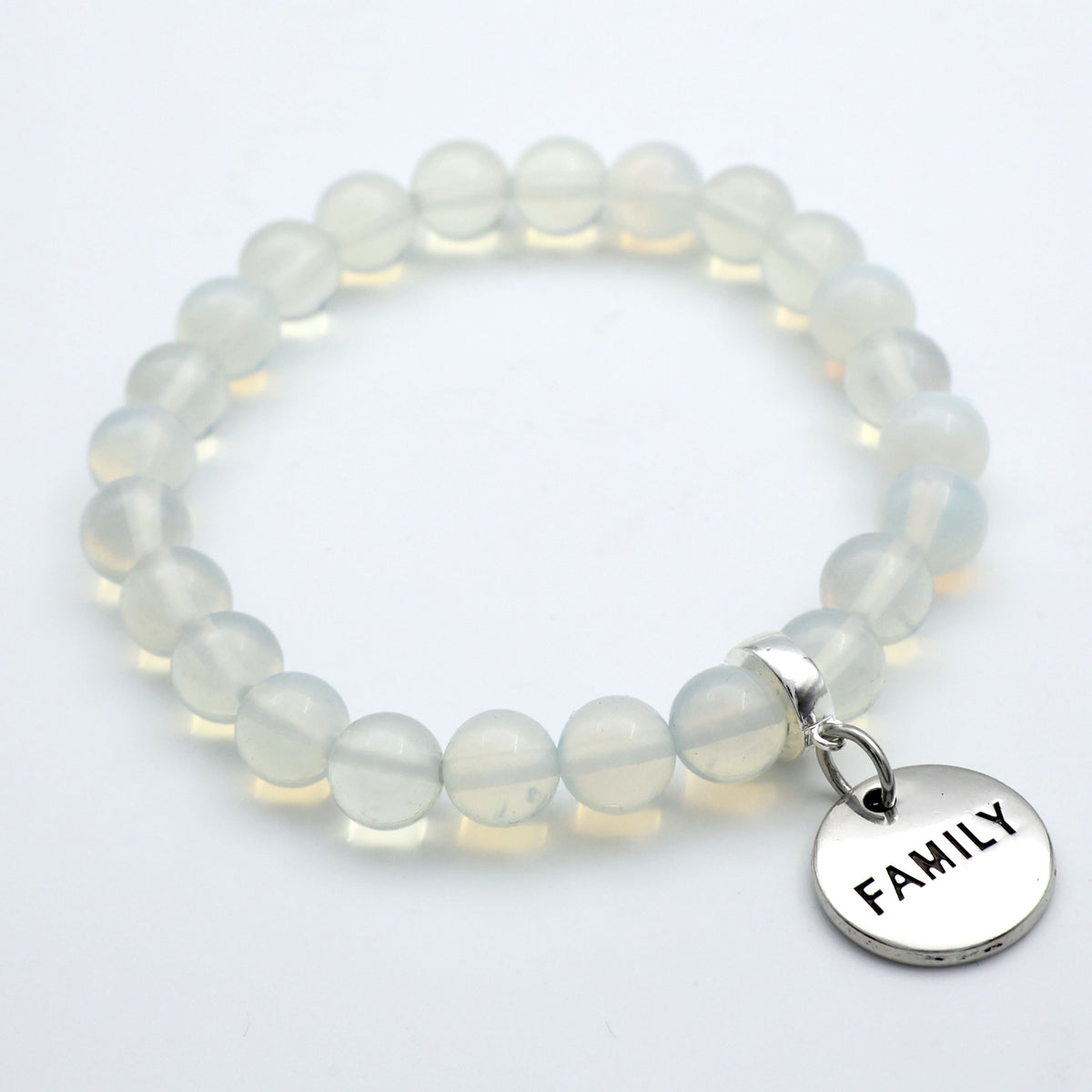 Beaded bracelet with a 'FAMILY' charm on a white background