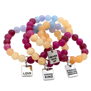 Group of brightly coloured stone beads with inspiring word charms. 
