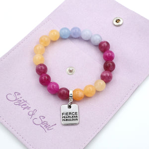 Multicolored beaded bracelet with 'Fierce Fearless Fabulous' charm on a pink card.
