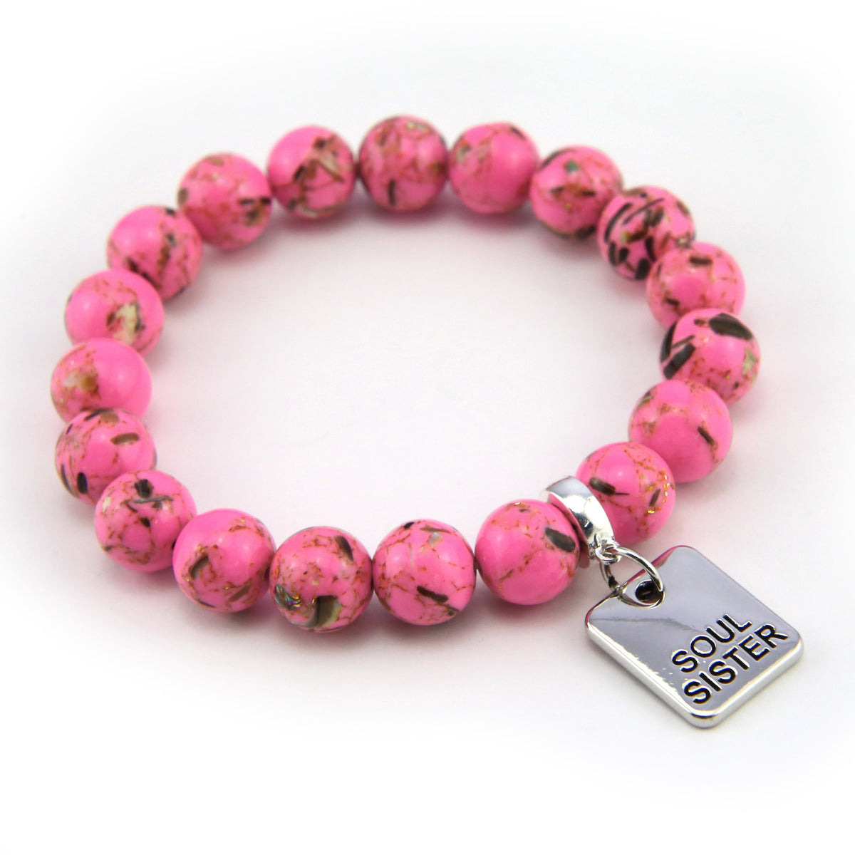 Pink beaded bracelet with a 'Soul Sister' charm on a white background