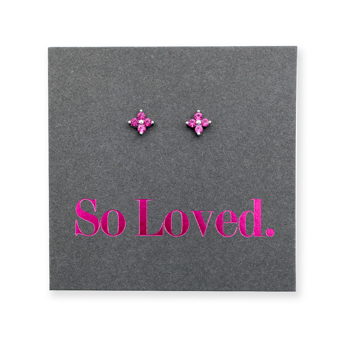 Pink tiny floral star shaped studs presented on a grey card with pink 'So Loved' writing.