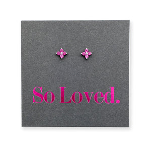 Pink tiny floral star shaped studs presented on a grey card with pink 'So Loved' writing.