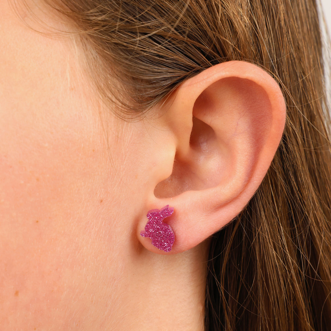 pink bunny studs in girls ear