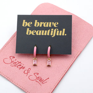 Pink earrings on a 'be brave beautiful' card with a pink envelope, featuring 'Sister & Soul' branding.