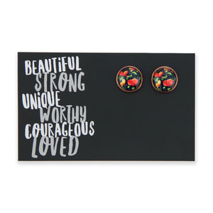 Floral patterned earrings on a black card with motivational text