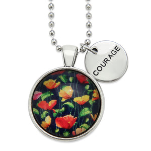 Necklace with floral pendant and 'COURAGE' tag on a white background