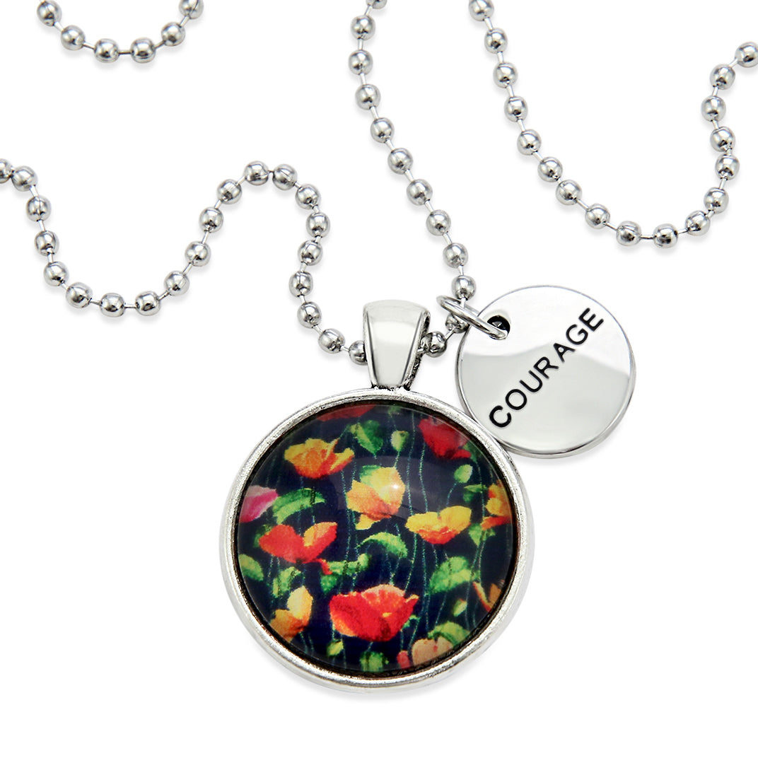 Necklace with floral pendant and 'COURAGE' tag on a white background