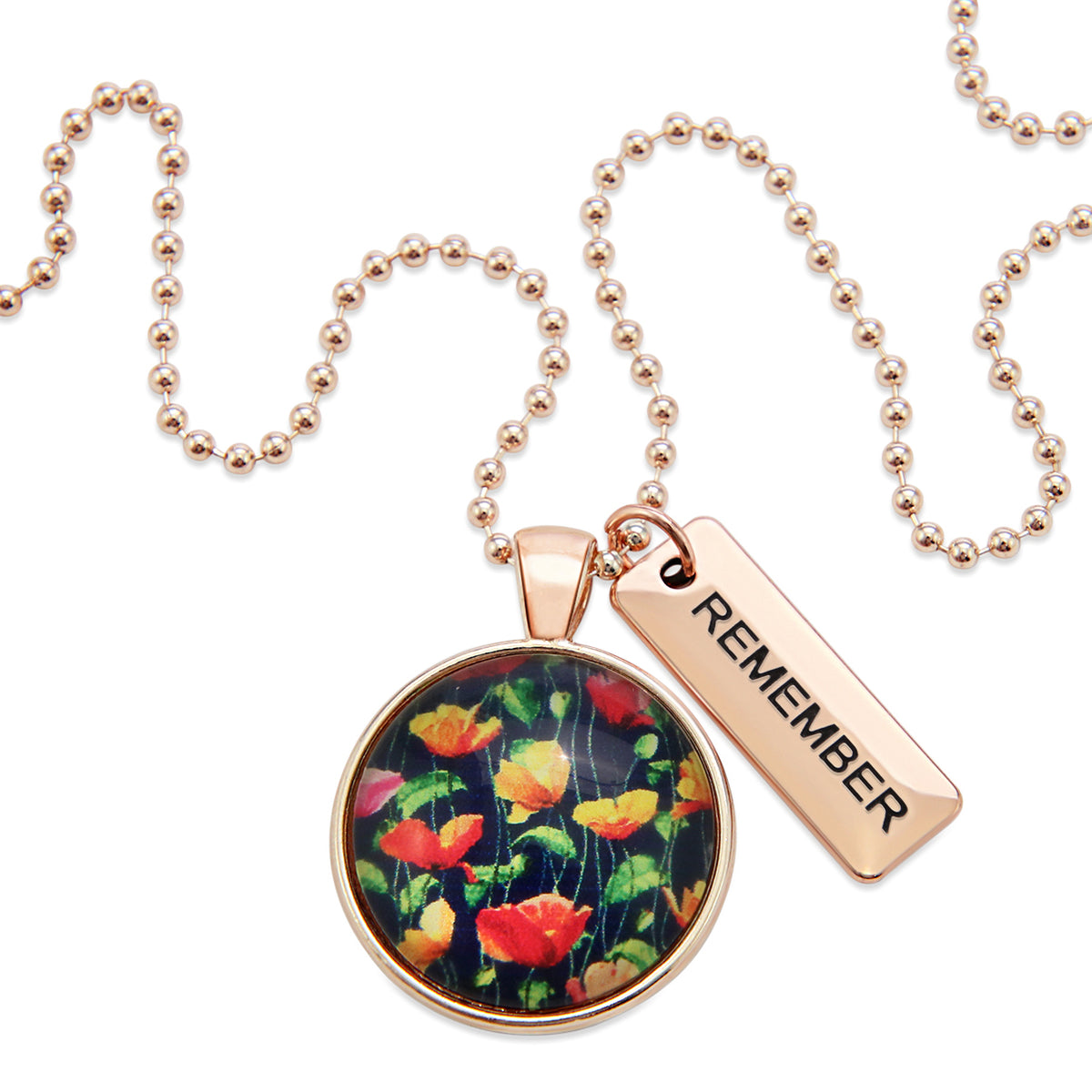 Necklace with floral pendant and 'REMEMBER' tag on a white background