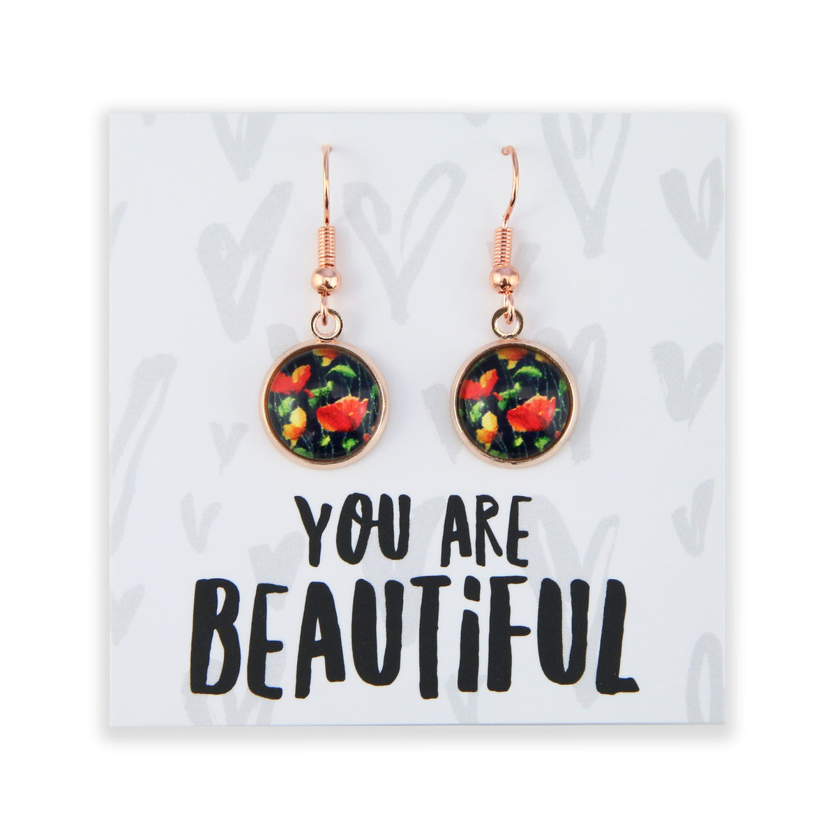 Floral earrings on a card with 'You are Beautiful' text