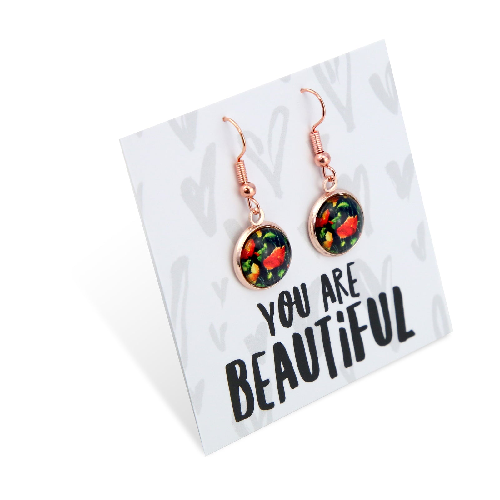 Floral earrings on a card with 'You are Beautiful' text