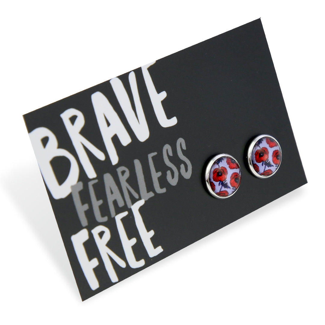 Pair of floral earrings on a card with 'Brave Fearless Free' text
