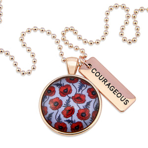 Necklace with floral pendant and 'COURAGEOUS' tag on a white background