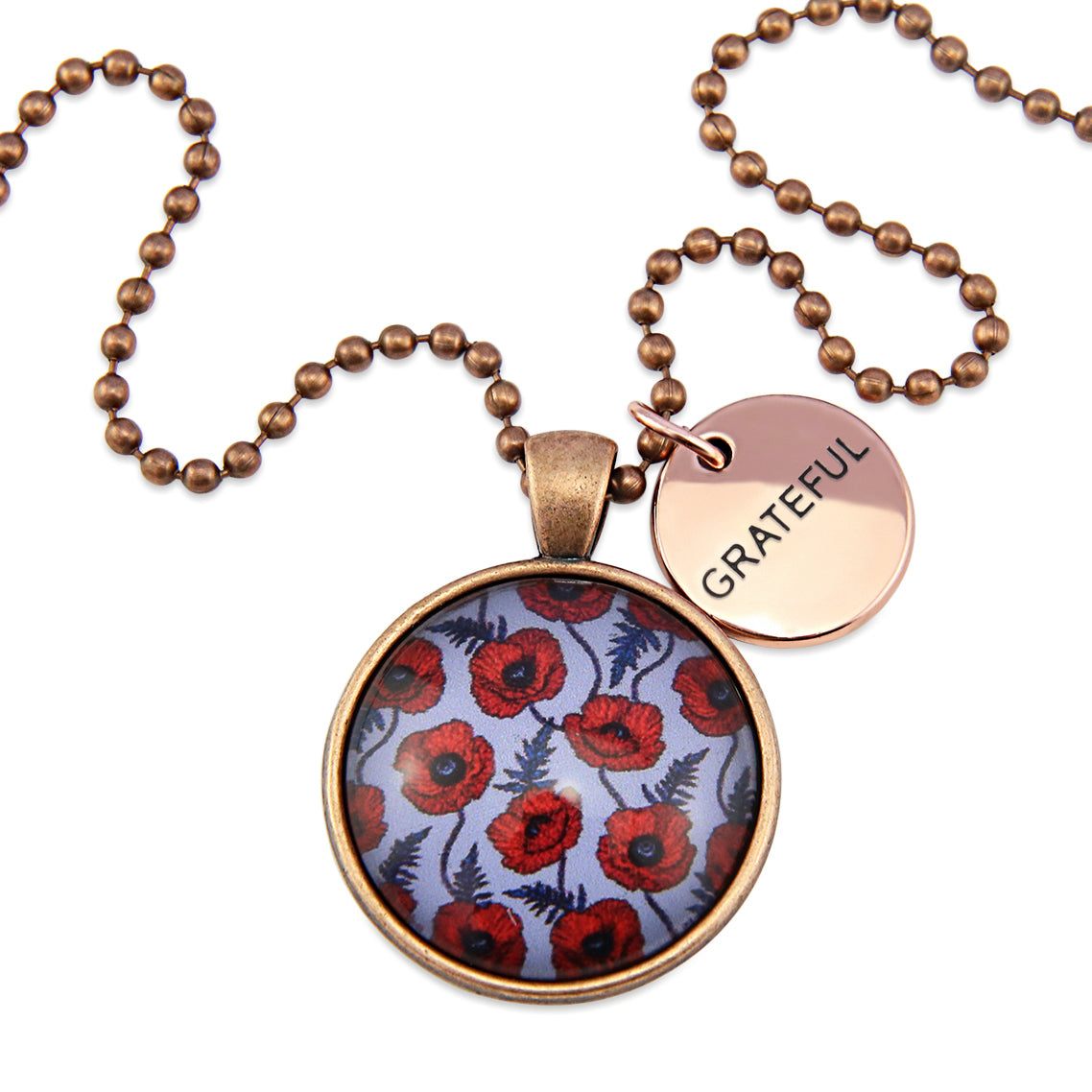 Necklace with floral pendant and 'GRATEFUL' tag on a white background