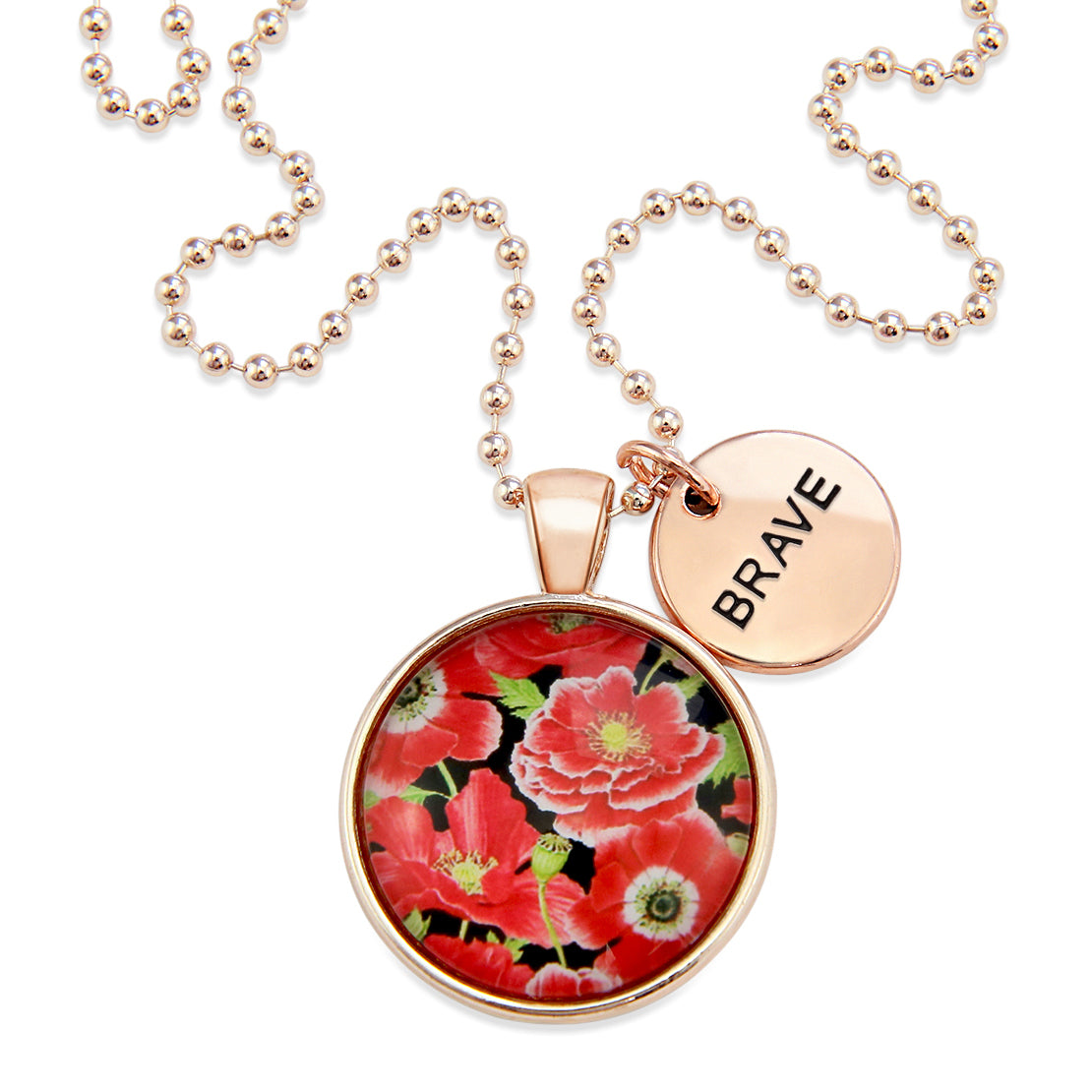 Necklace with floral pendant and 'BRAVE' tag on a white background